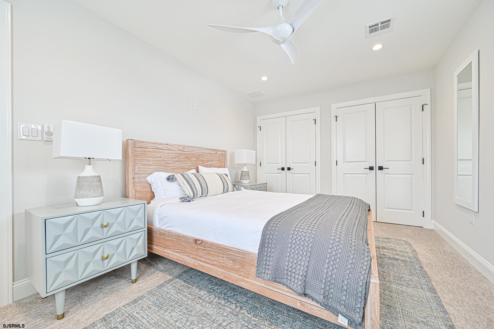 251 38th Street South Brigantine, NJ 08203 - Photo 50 of 63 a bedroom with a bed and a night stand