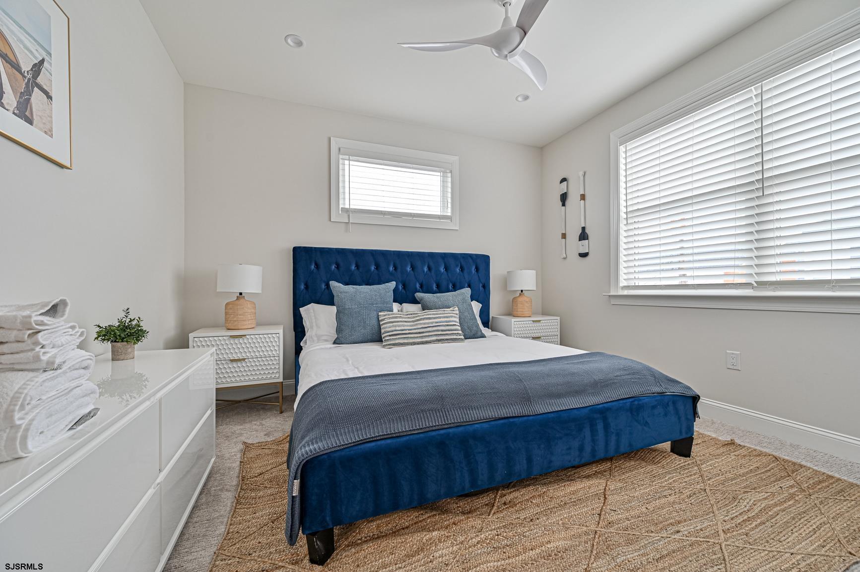 251 38th Street South Brigantine, NJ 08203 - Photo 51 of 63 a bedroom with a large bed and a window