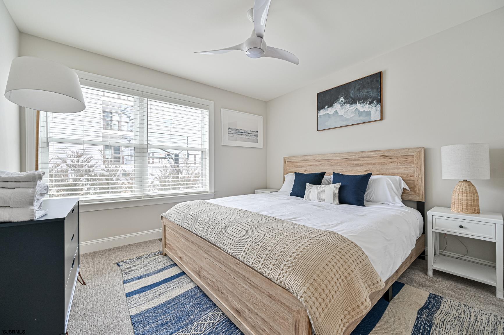 251 38th Street South Brigantine, NJ 08203 - Photo 56 of 63 a bedroom with bed and a large window