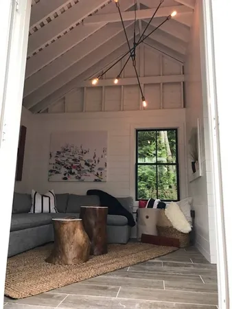 a living room with a couch and a fireplace