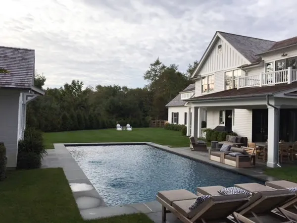 a front view of house with yard and outdoor seating