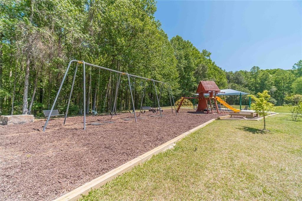 395 Amberbrook Circle Grayson, GA 30017 - Photo 63 of 66 a view of a park with swings