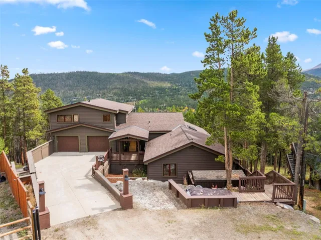 a view of a patio with table and chairs and potted plants