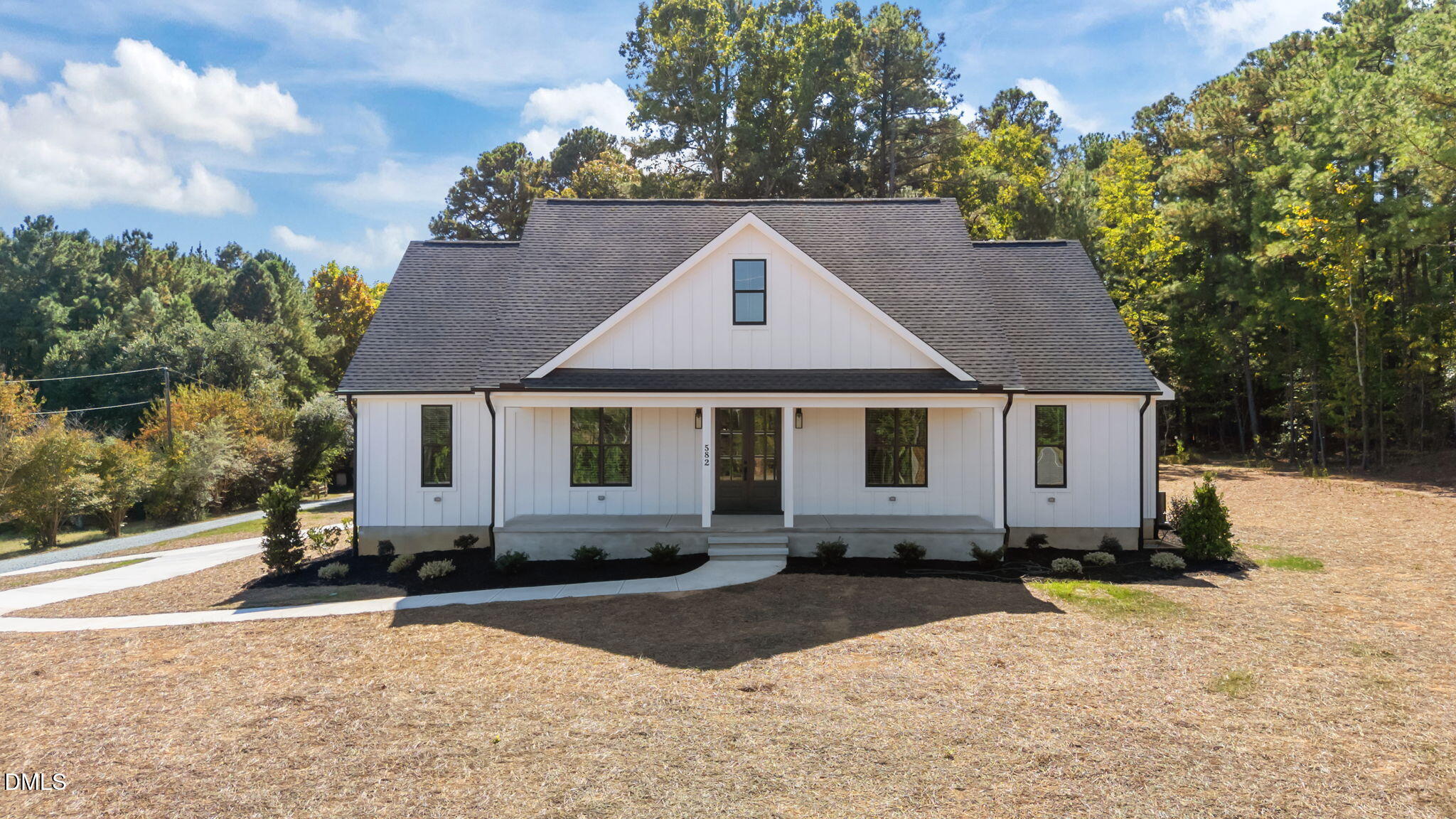 582 Harnett Central Road Fuquay-Varina, NC 27526 - Photo 1 of 51 a front view of a house with a yard