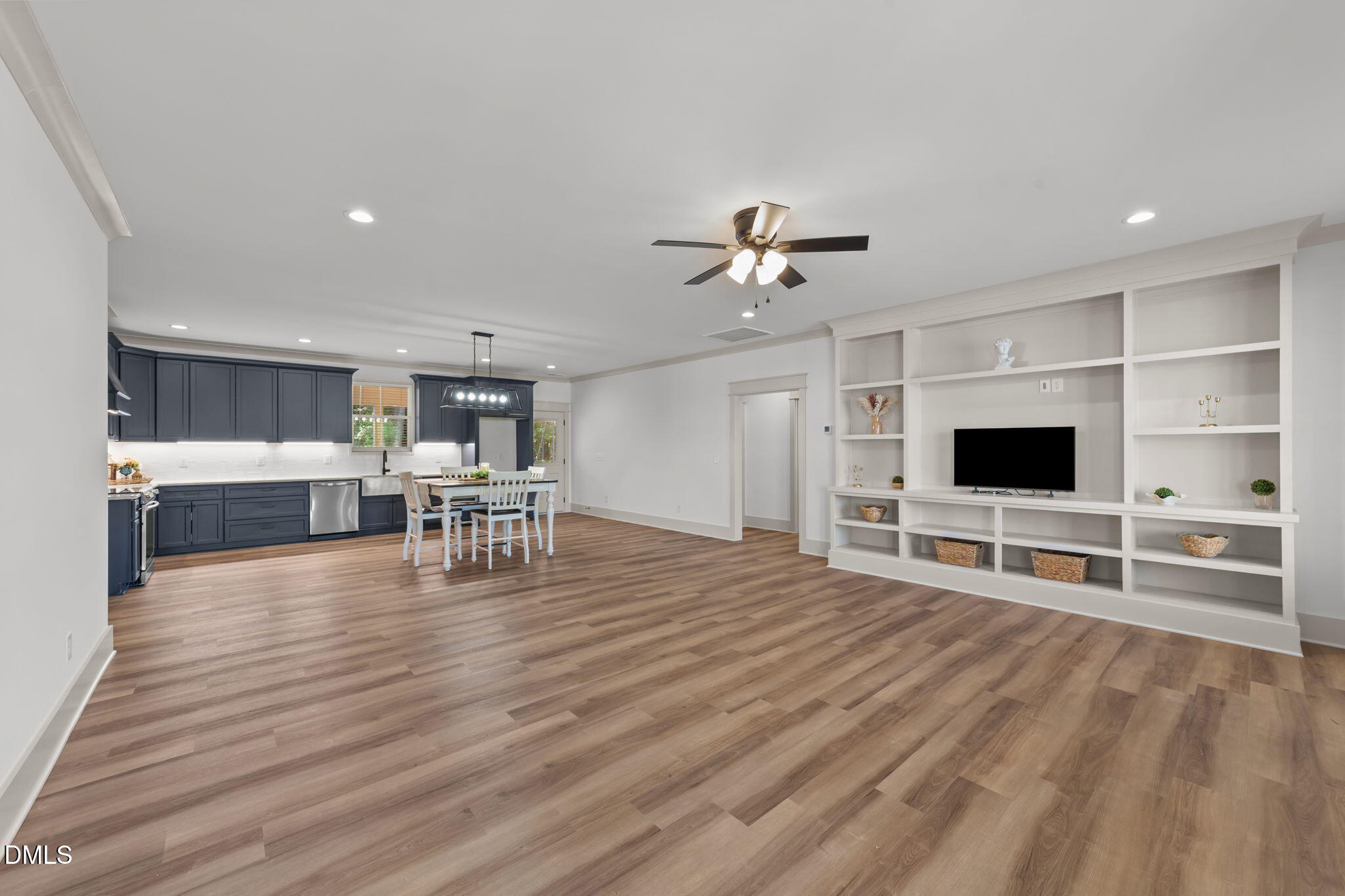 582 Harnett Central Road Fuquay-Varina, NC 27526 - Photo 22 of 51 a living room with furniture and a flat screen tv