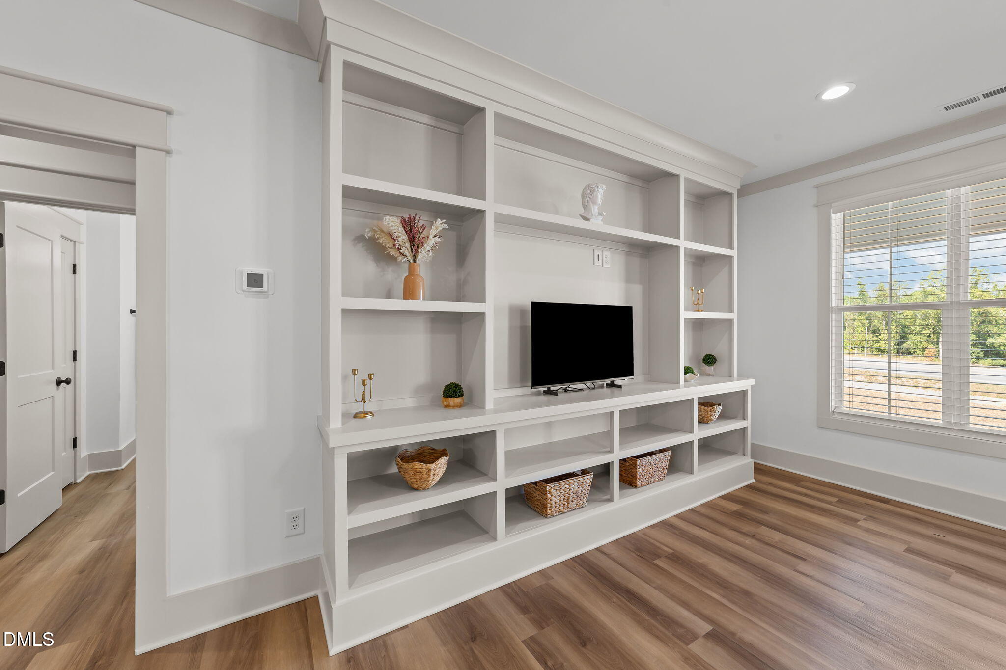582 Harnett Central Road Fuquay-Varina, NC 27526 - Photo 25 of 51 a room with a flat screen tv and a window