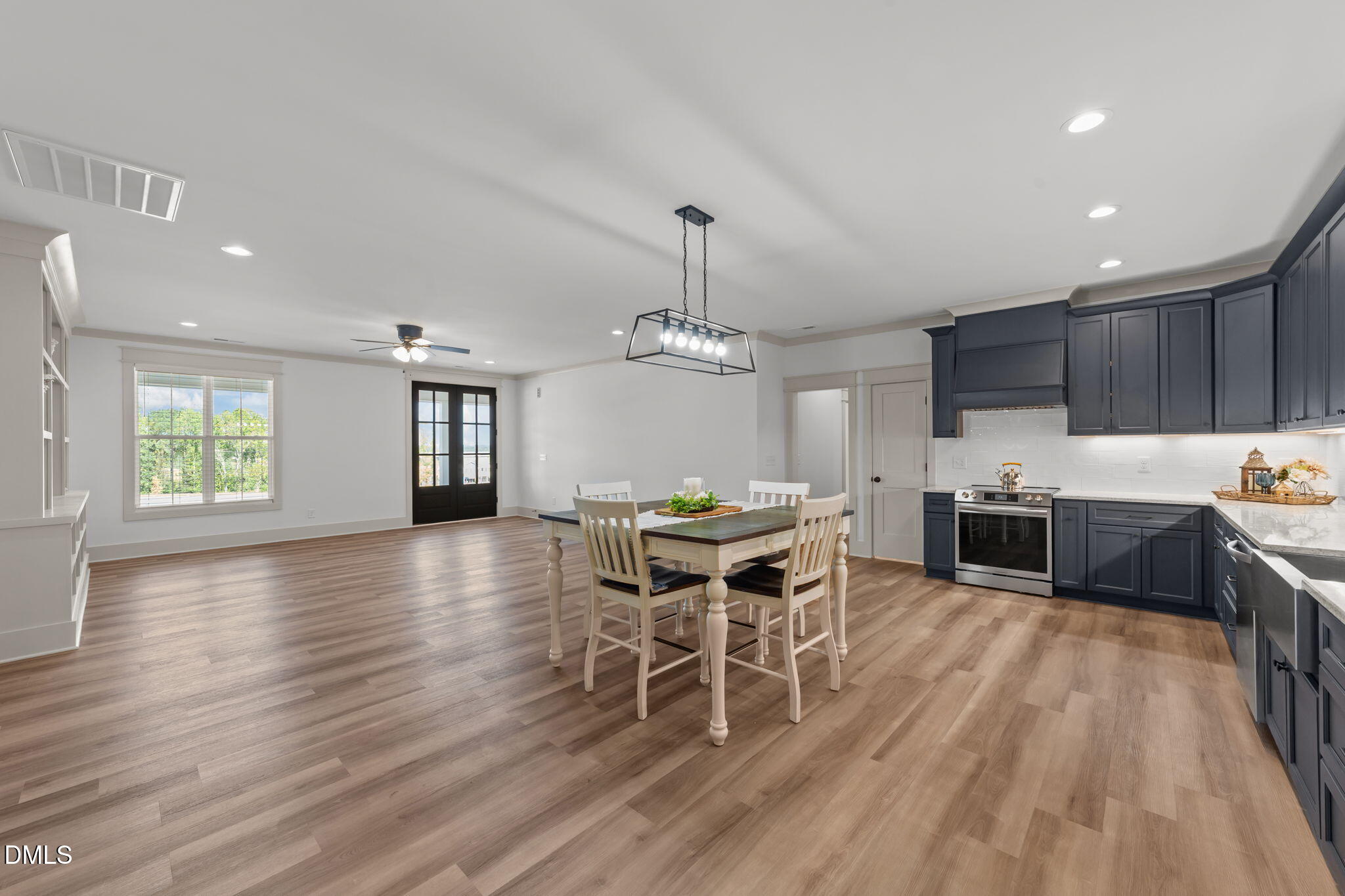 582 Harnett Central Road Fuquay-Varina, NC 27526 - Photo 29 of 51 a view of a dining room with furniture window and wooden floor