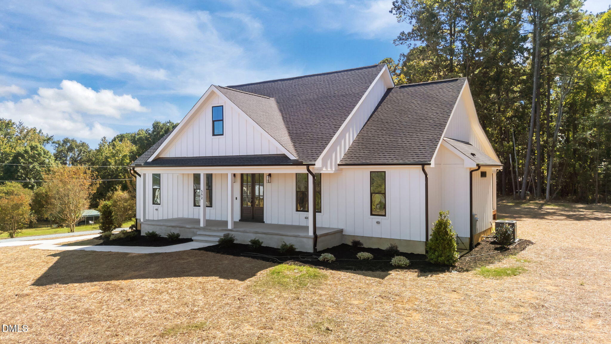 582 Harnett Central Road Fuquay-Varina, NC 27526 - Photo 3 of 51 a front view of a house with a yard