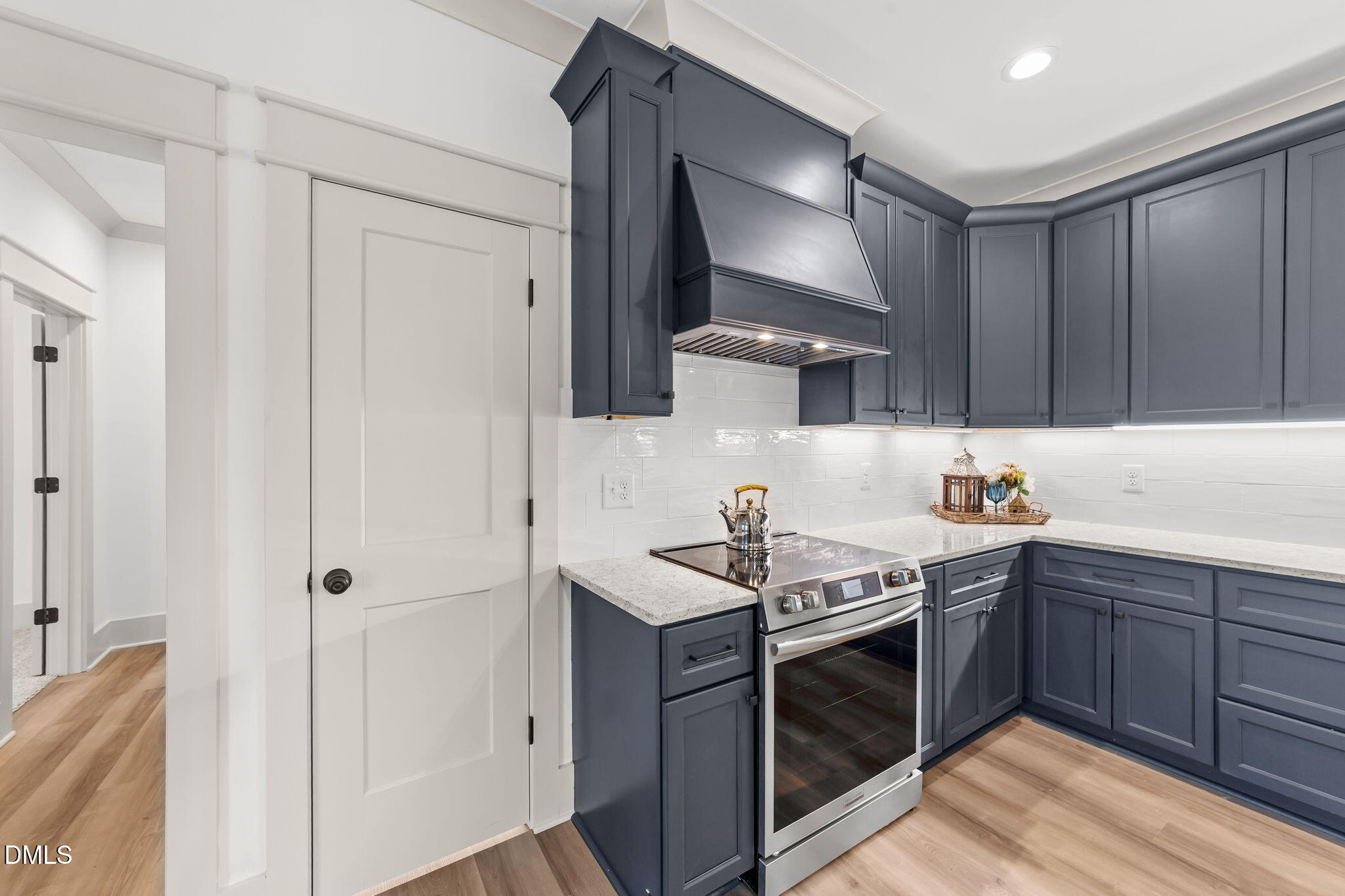 582 Harnett Central Road Fuquay-Varina, NC 27526 - Photo 33 of 51 a kitchen with stainless steel appliances granite countertop a sink stove and cabinets