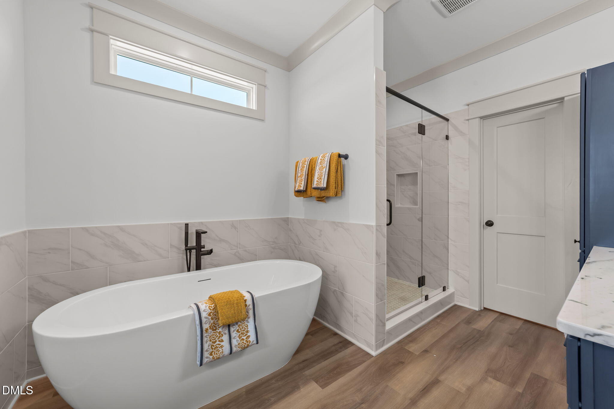 582 Harnett Central Road Fuquay-Varina, NC 27526 - Photo 39 of 51 a white bath tub sitting next to a bathroom