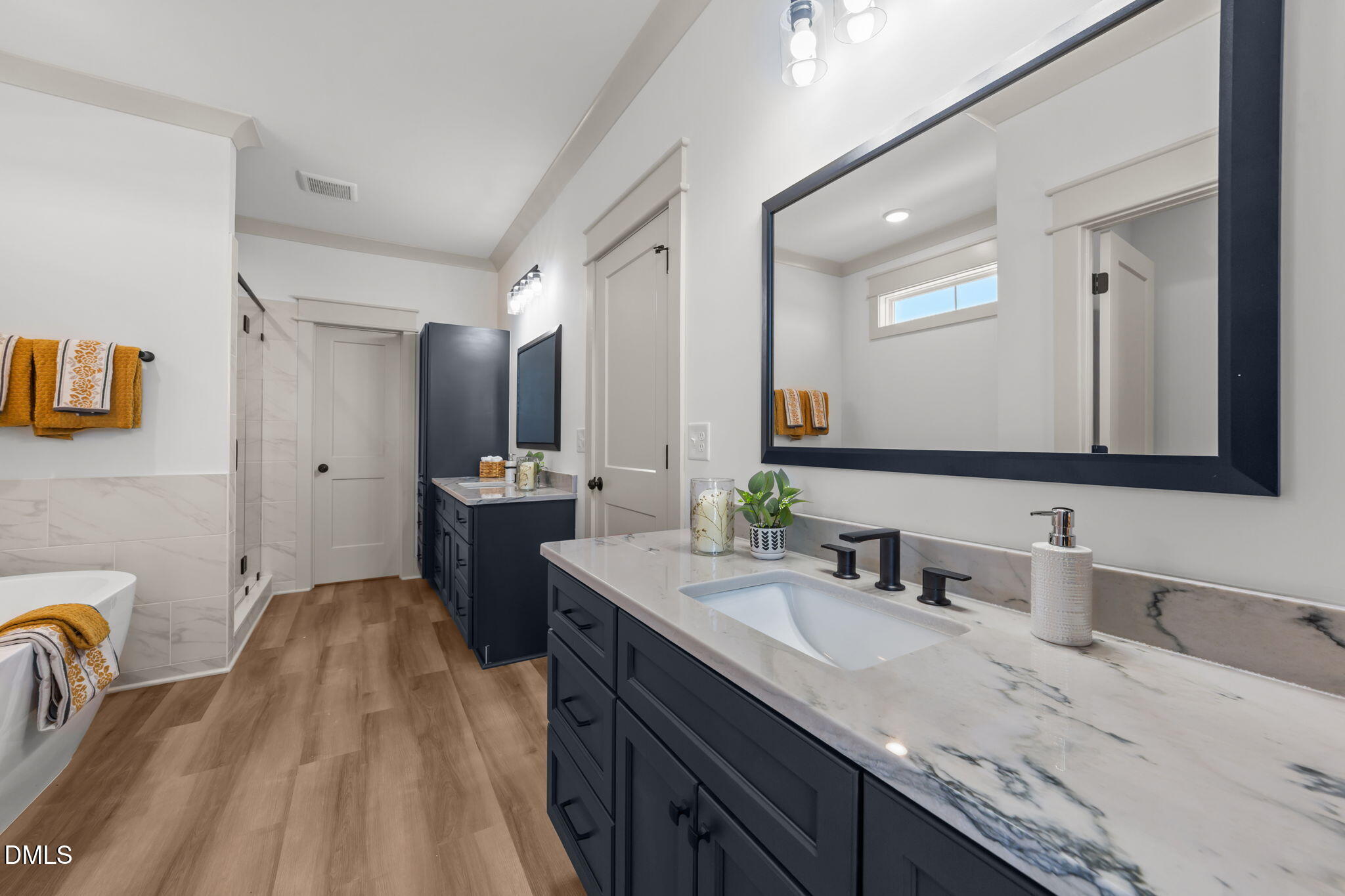 582 Harnett Central Road Fuquay-Varina, NC 27526 - Photo 40 of 51 a bathroom with a granite countertop double vanity sink and mirror
