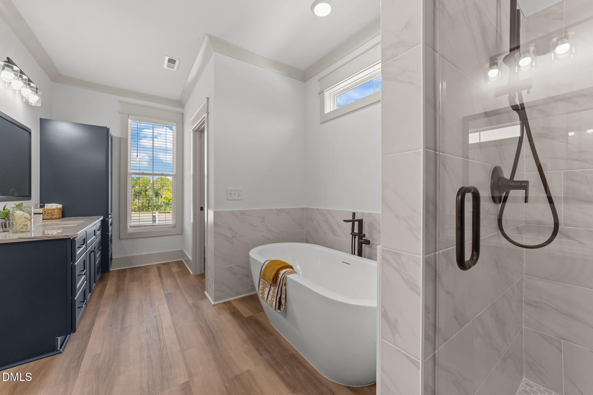 582 Harnett Central Road Fuquay-Varina, NC 27526 - Photo 42 of 51 a bathroom with a tub sink and mirror