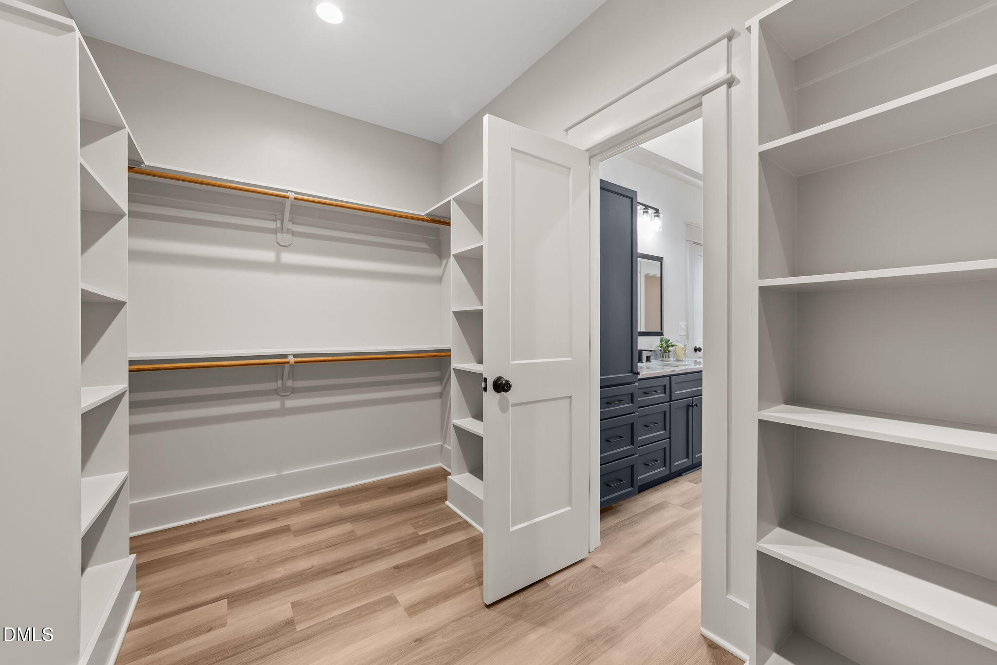 582 Harnett Central Road Fuquay-Varina, NC 27526 - Photo 43 of 51 a view of walk in closet with empty racks