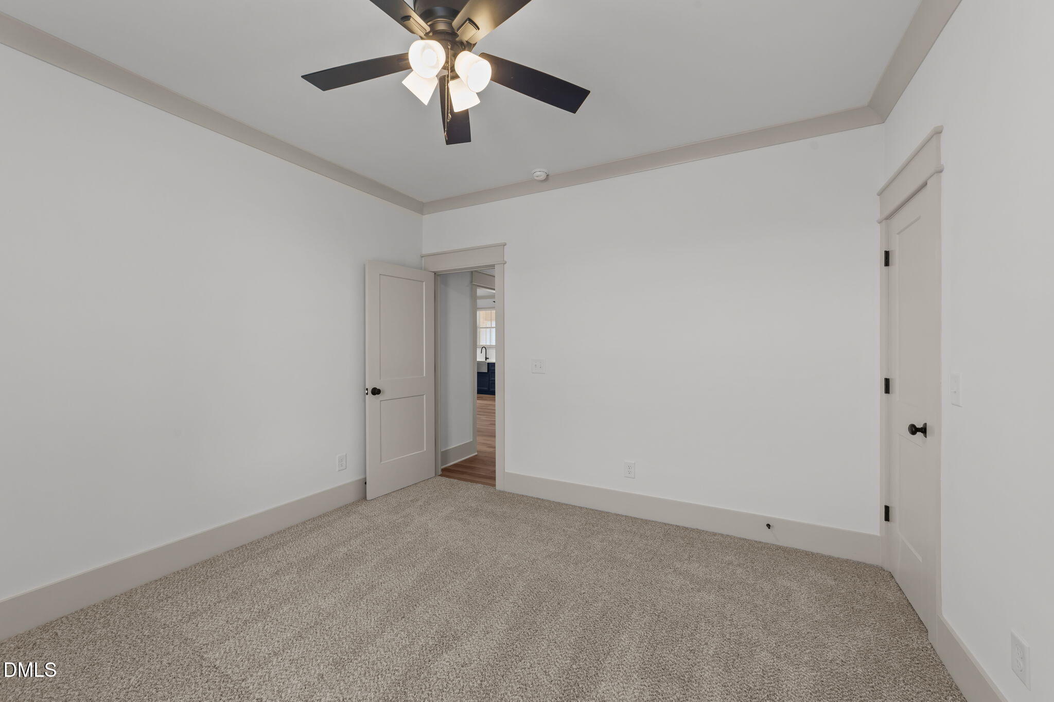 582 Harnett Central Road Fuquay-Varina, NC 27526 - Photo 48 of 51 an empty room with chandelier fan
