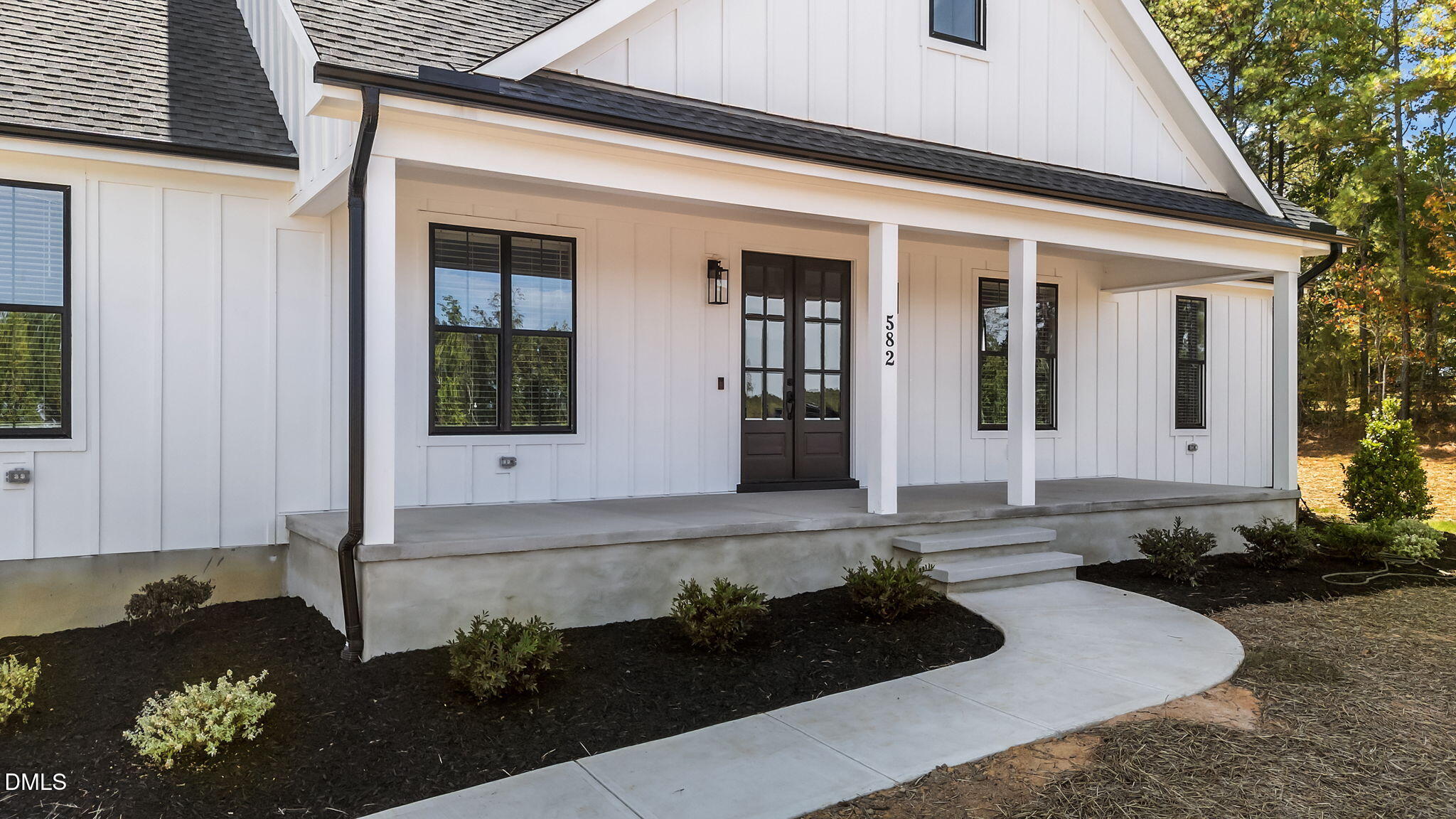 582 Harnett Central Road Fuquay-Varina, NC 27526 - Photo 5 of 51 a front view of a house with a yard