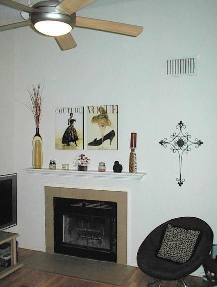 106 East 30th Street, Unit 307 Austin, TX 78705 - Photo 2 of 10 a living room with furniture and a fireplace