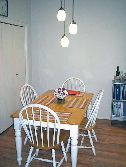 106 East 30th Street, Unit 307 Austin, TX 78705 - Photo 3 of 10 a view of a dining room with furniture and wooden floor