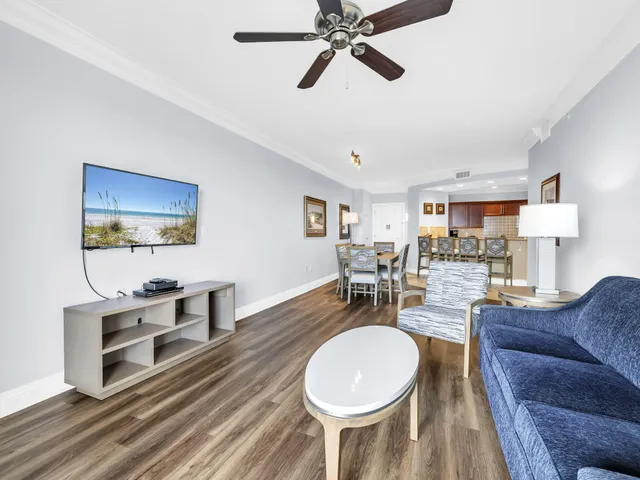 a kitchen with stainless steel appliances granite countertop a refrigerator stove and sink
