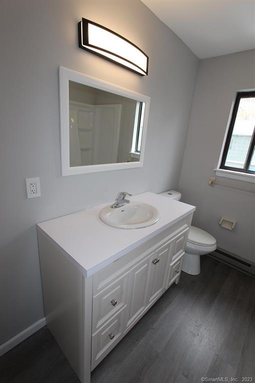 1400 Meriden Road, Unit 52 Waterbury, CT 06705 - Photo 14 of 21 a bathroom with a sink toilet and mirror