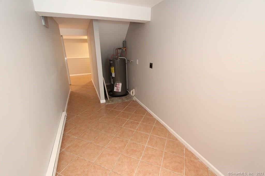 1400 Meriden Road, Unit 52 Waterbury, CT 06705 - Photo 19 of 21 a view of a hallway with closet