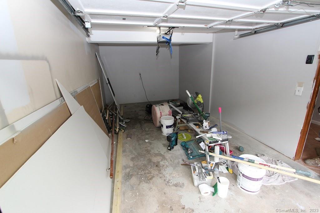 1400 Meriden Road, Unit 52 Waterbury, CT 06705 - Photo 20 of 21 a view of a room with rack and white walls