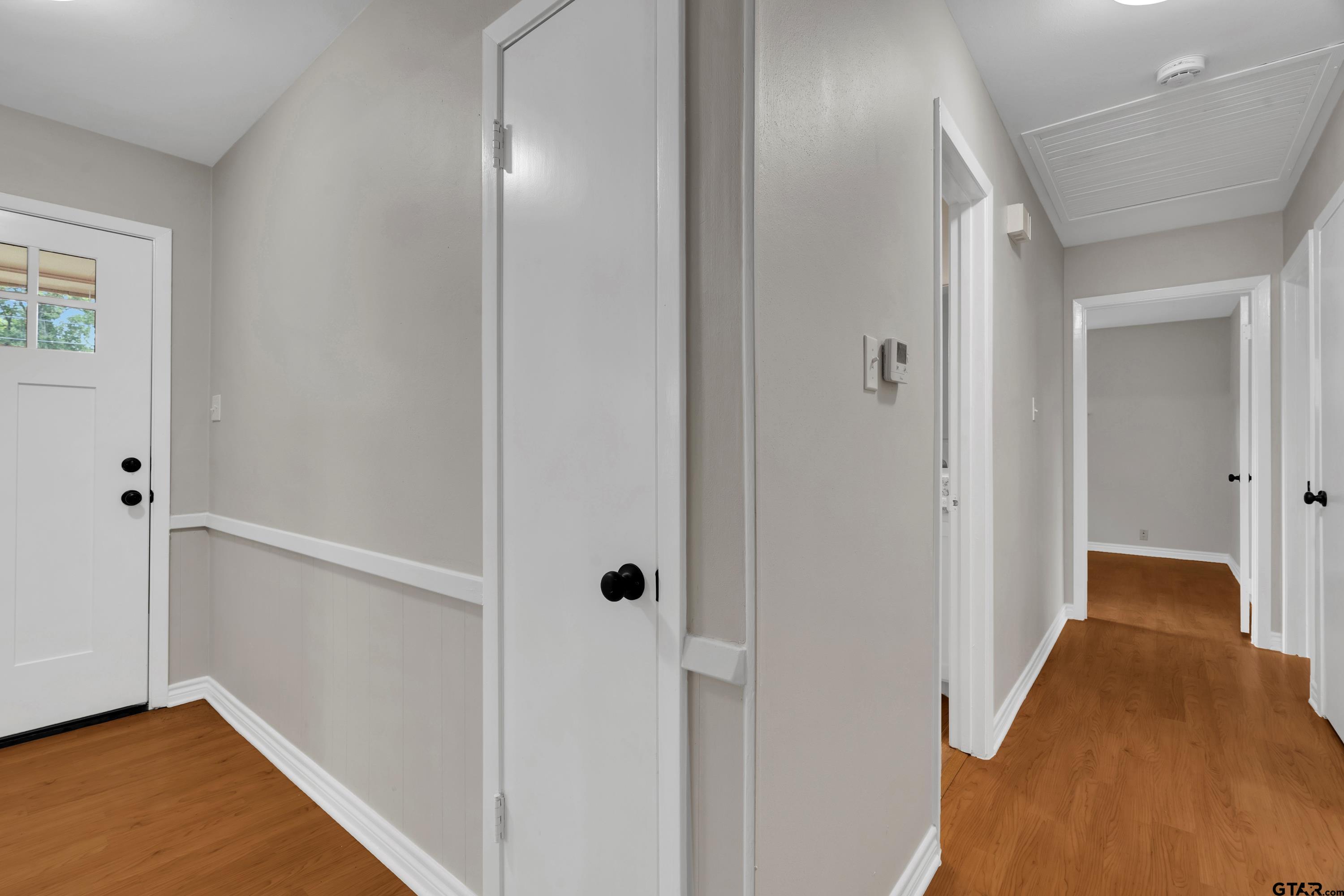 12813 Sunset Drive Tyler, TX 75704 - Photo 16 of 34 a view of a hallway with wooden floor and closet