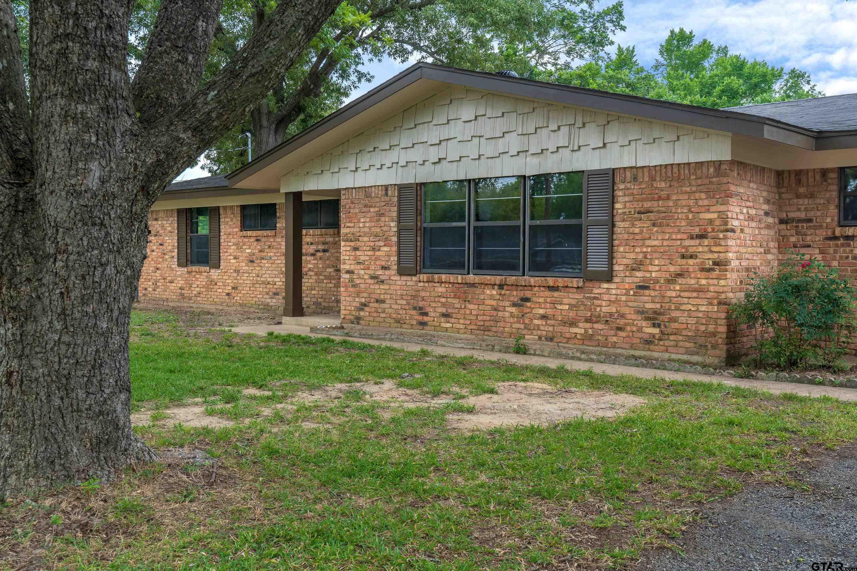 12813 Sunset Drive Tyler, TX 75704 - Photo 34 of 34 a front view of a house with garden