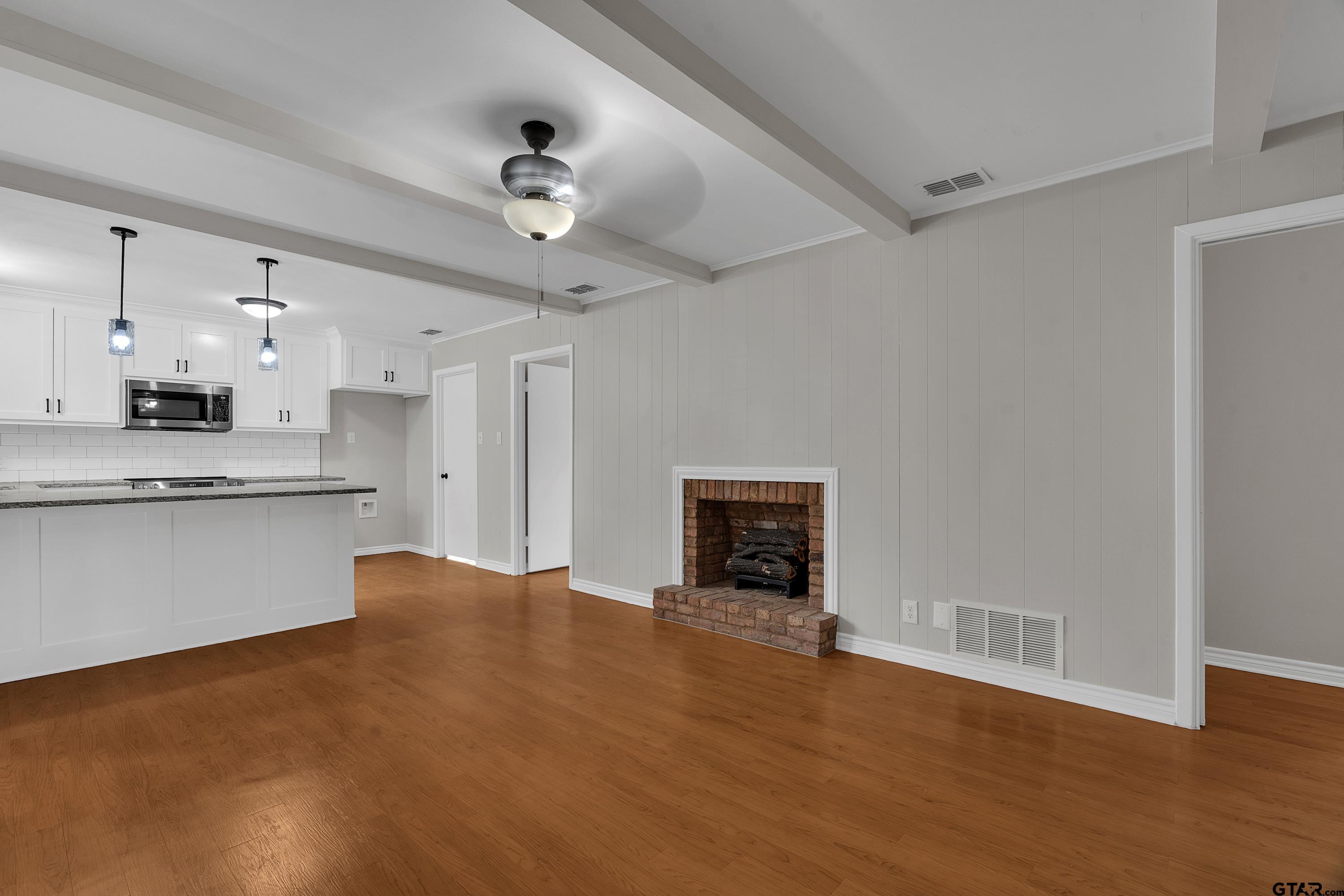 12813 Sunset Drive Tyler, TX 75704 - Photo 7 of 34 a large kitchen with cabinets and stainless steel appliances