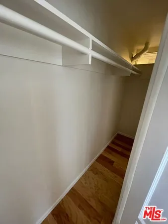 a view of a room with racks on the wall