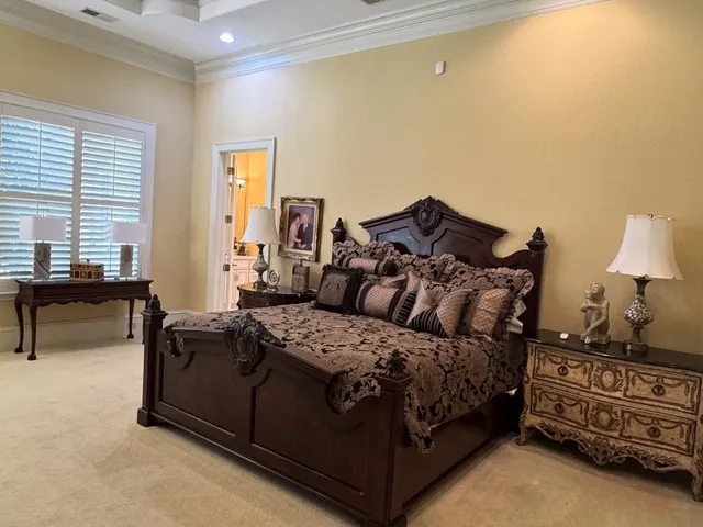 a bedroom with a bed and a couch