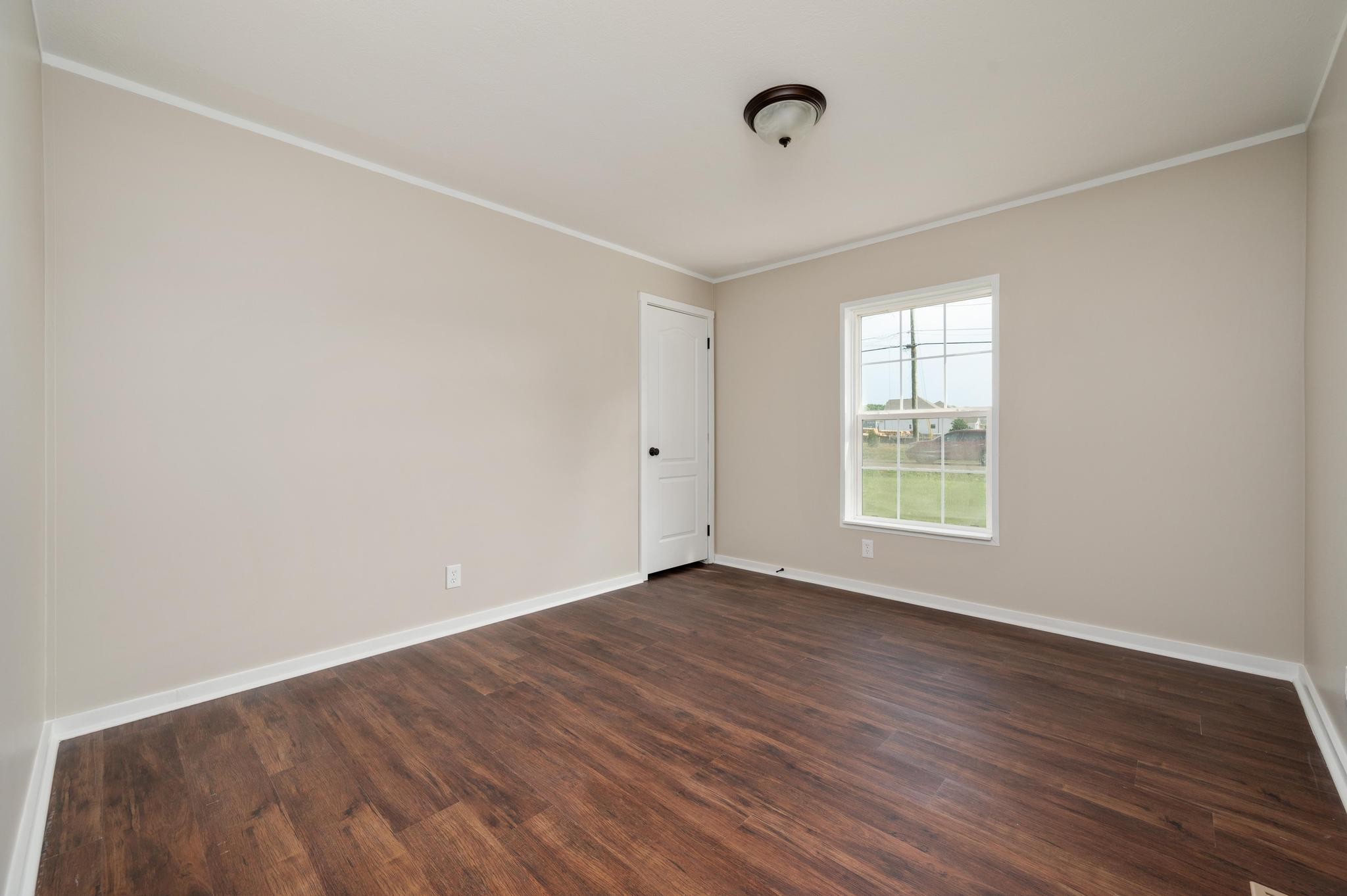 3787 Asbury Road Murfreesboro, TN 37129 - Photo 16 of 20 an empty room with wooden floor and windows