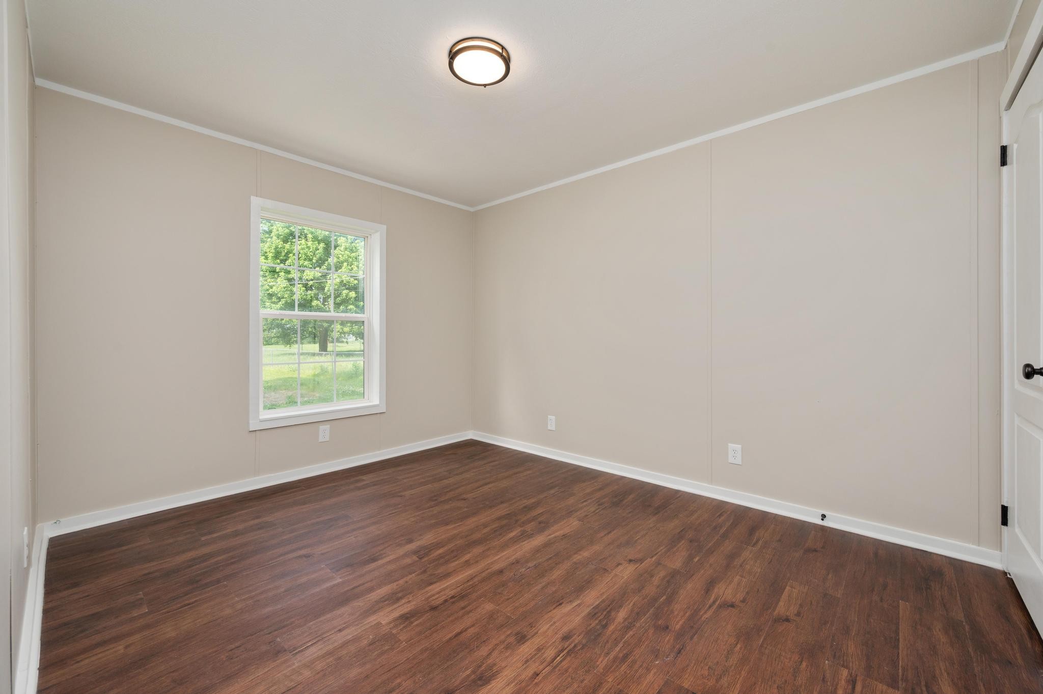 3787 Asbury Road Murfreesboro, TN 37129 - Photo 17 of 20 an empty room with wooden floor and windows