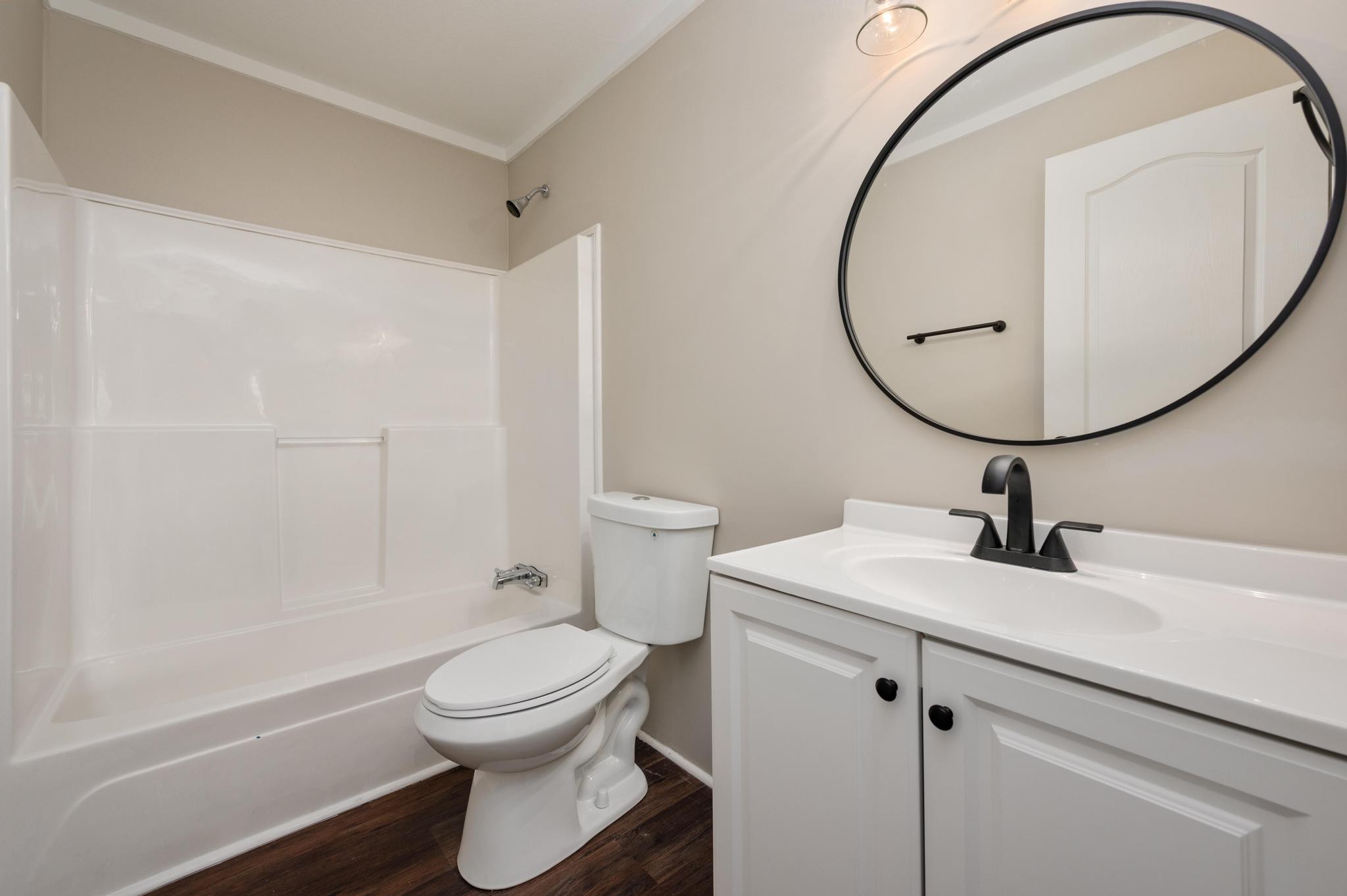 3787 Asbury Road Murfreesboro, TN 37129 - Photo 18 of 20 a bathroom with a sink a toilet and a mirror