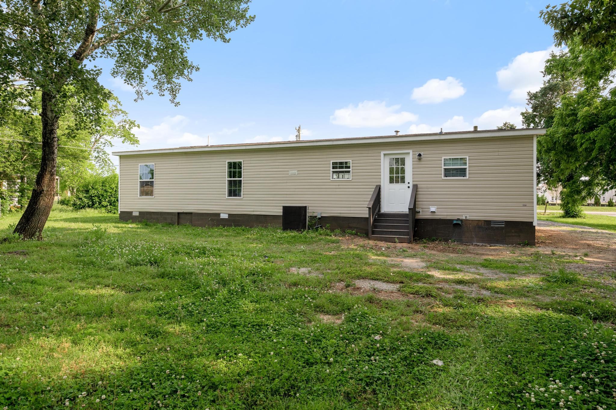 3787 Asbury Road Murfreesboro, TN 37129 - Photo 20 of 20 a view of a house with a yard and a large tree