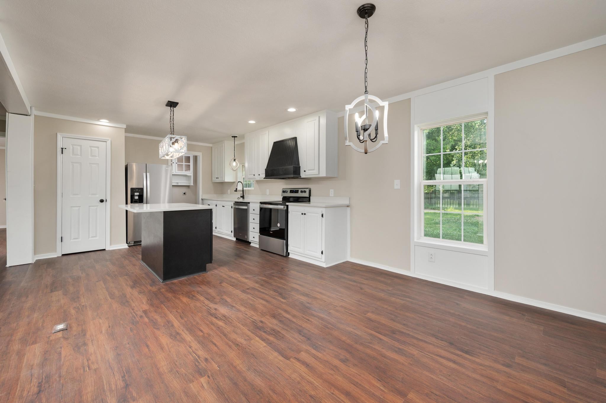 3787 Asbury Road Murfreesboro, TN 37129 - Photo 6 of 20 a view of a kitchen with a sink wooden floor and a window