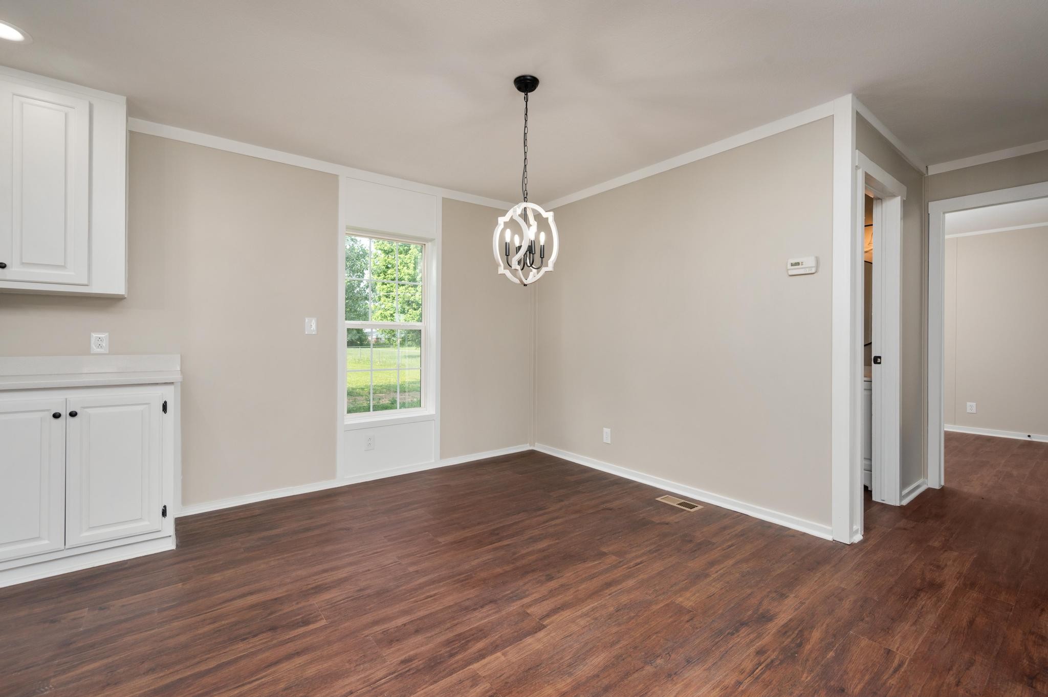 3787 Asbury Road Murfreesboro, TN 37129 - Photo 7 of 20 a view of a room with wooden floor fan and window