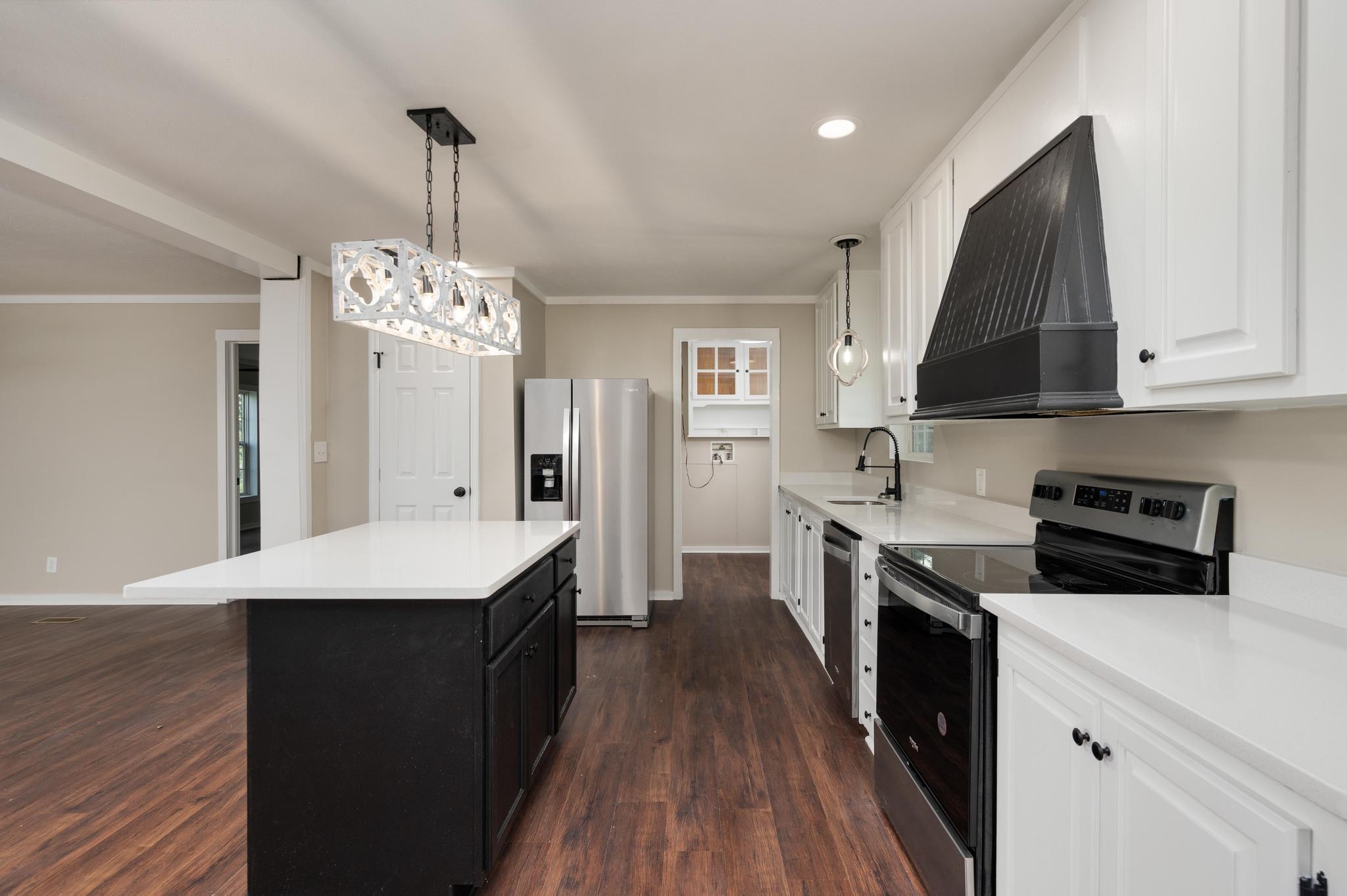 3787 Asbury Road Murfreesboro, TN 37129 - Photo 9 of 20 a kitchen with stainless steel appliances a sink stove and refrigerator