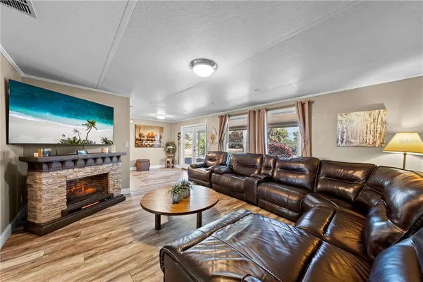 a kitchen with stainless steel appliances granite countertop a stove sink microwave and refrigerator