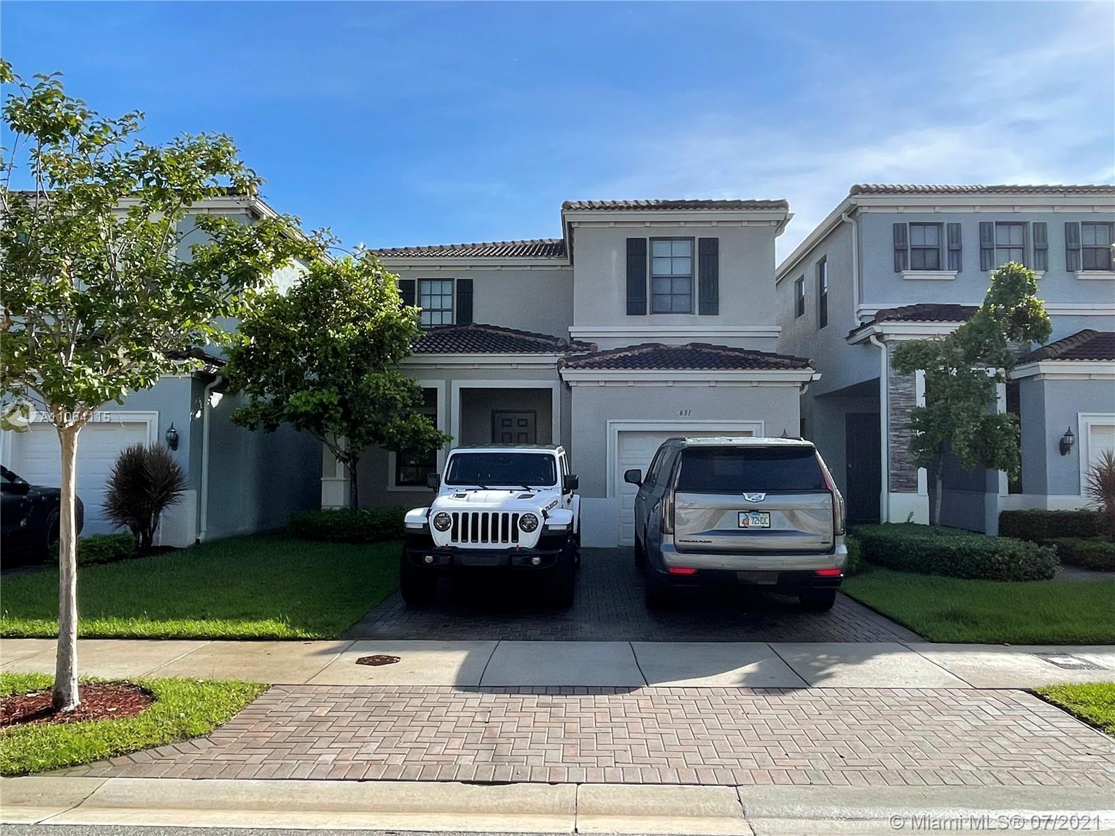 631 Northeast 191st Terrace Miami, FL 33179 - Photo 1 of 28 a house view with a garden space