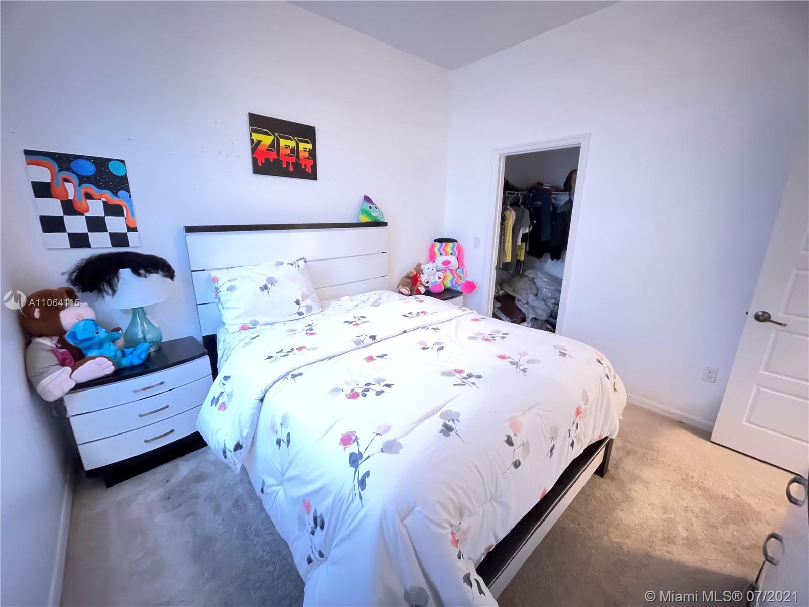 631 Northeast 191st Terrace Miami, FL 33179 - Photo 17 of 28 a bedroom with a bed and a couch