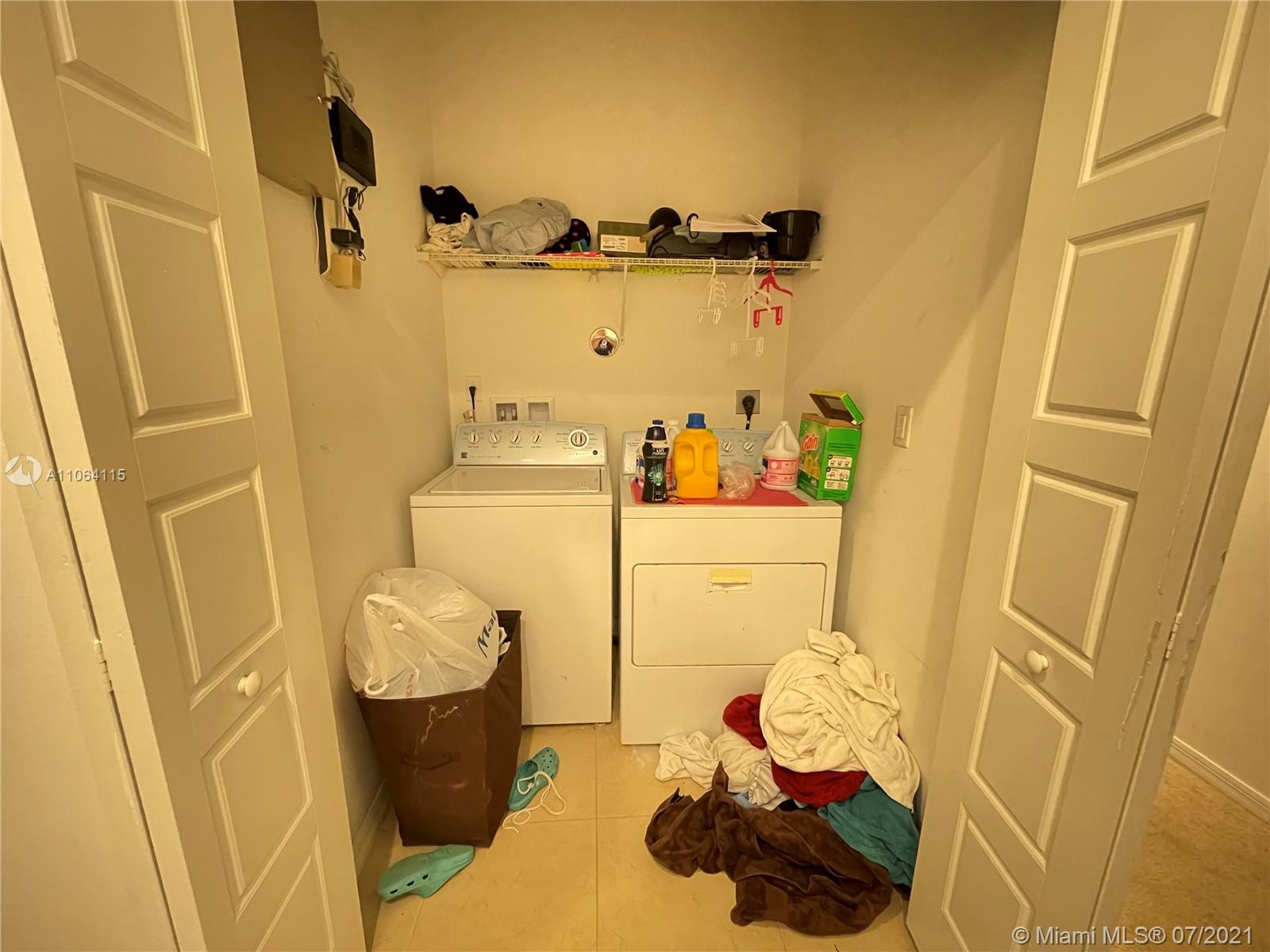 631 Northeast 191st Terrace Miami, FL 33179 - Photo 20 of 28 a bathroom with a sink and toilet