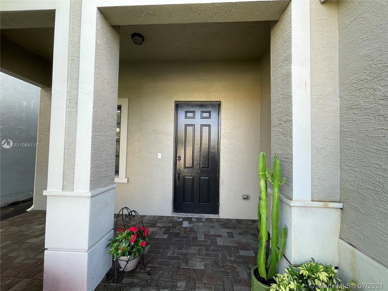 631 Northeast 191st Terrace Miami, FL 33179 - Photo 3 of 28 a front view of a house with an outdoor space
