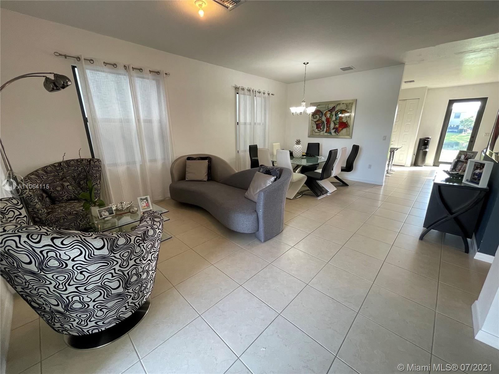 631 Northeast 191st Terrace Miami, FL 33179 - Photo 5 of 28 a living room with furniture and a couch