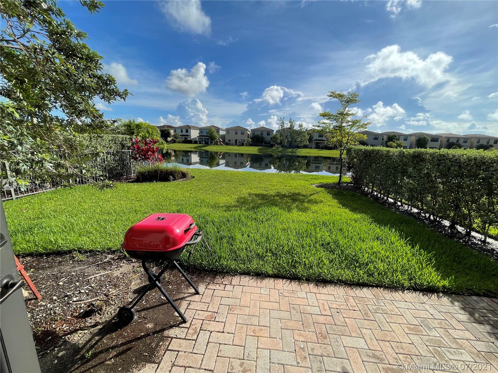 631 Northeast 191st Terrace Miami, FL 33179 - Photo 10 of 28 a view of a backyard with a garden and entertaining space