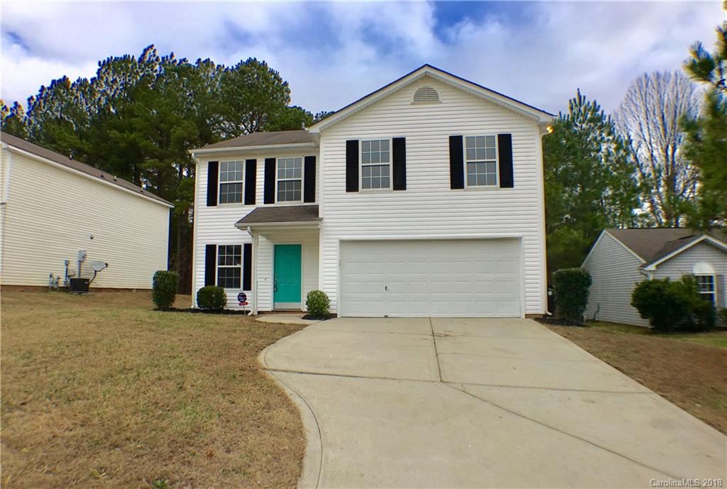 2543 Captains Watch Road Northeast Kannapolis, NC 28083 - Photo 1 of 17 a view of a white house with a yard and plants