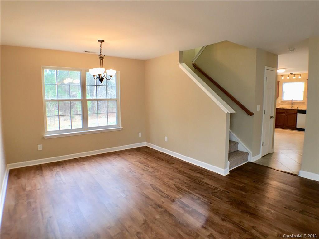 2543 Captains Watch Road Northeast Kannapolis, NC 28083 - Photo 6 of 17 a view of an empty room with wooden floor and a window