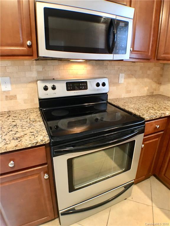 2543 Captains Watch Road Northeast Kannapolis, NC 28083 - Photo 8 of 17 a stove top oven sitting inside of a kitchen