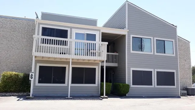 a front view of a house with garage