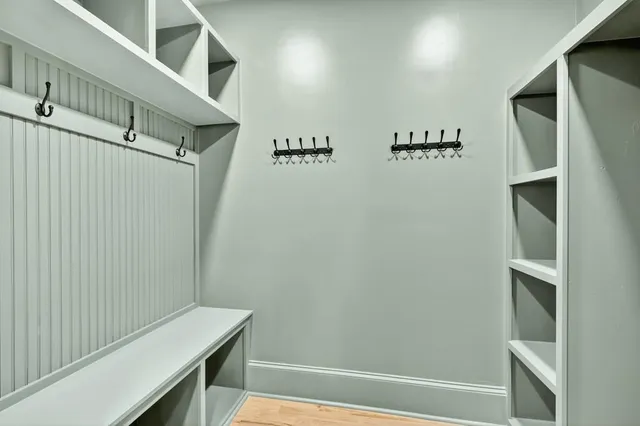 a view of kitchen with cabinets and window