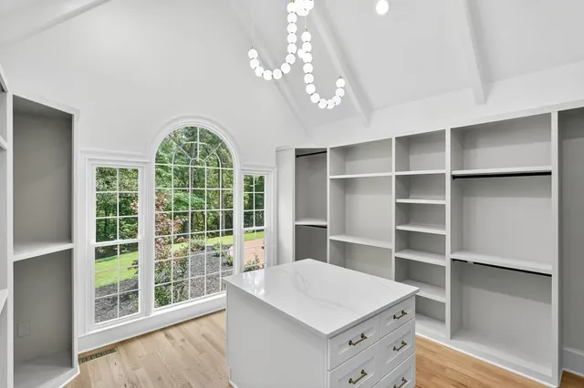 an empty room with a kitchen and a sink